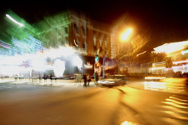 Nighttime city street with light trails