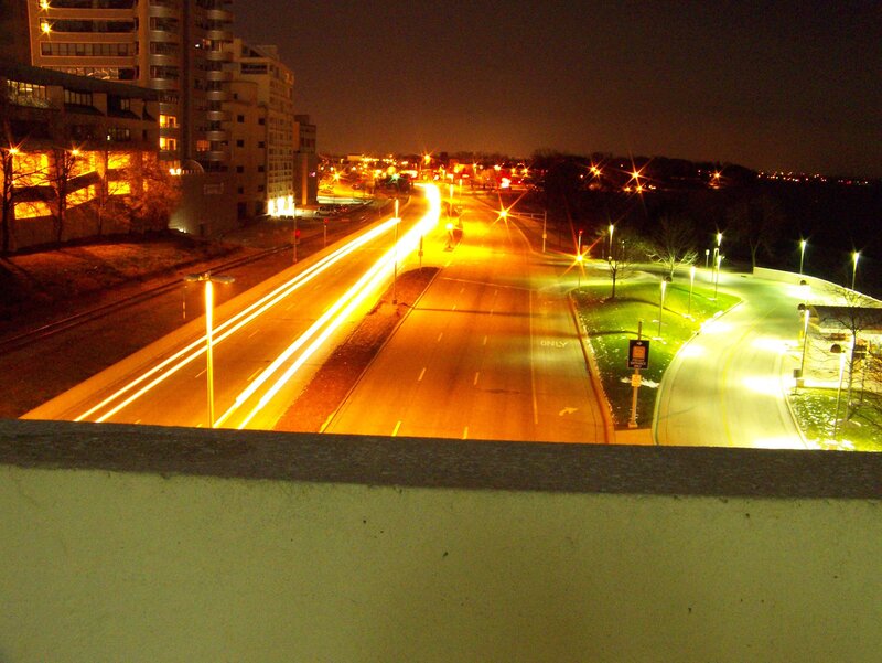 Nighttime city street with light trails