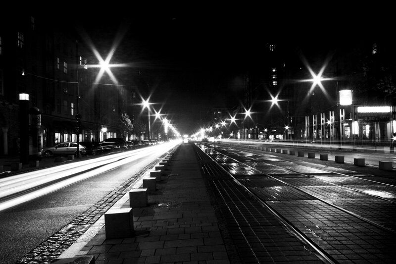 Nighttime city street with light trails