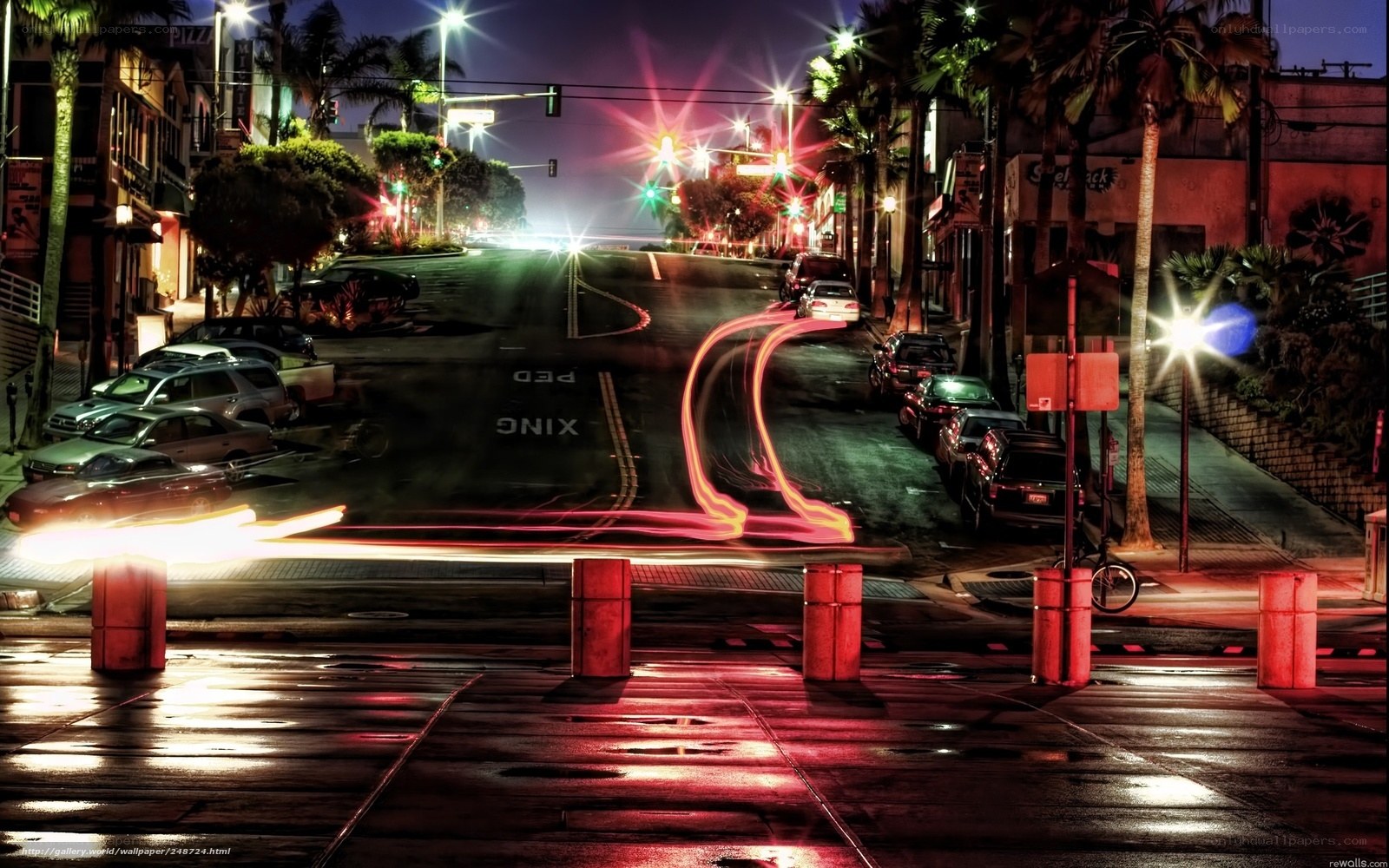 nighttime city street with light trails