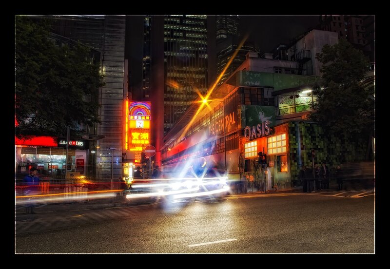 Nighttime city street with light trails
