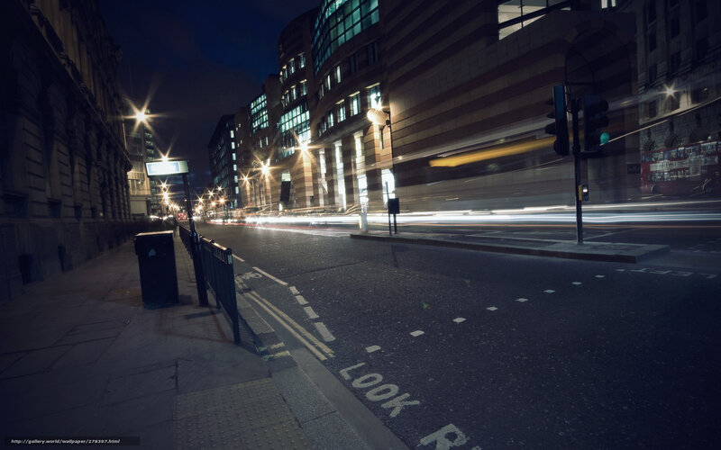Nighttime city street with light trails