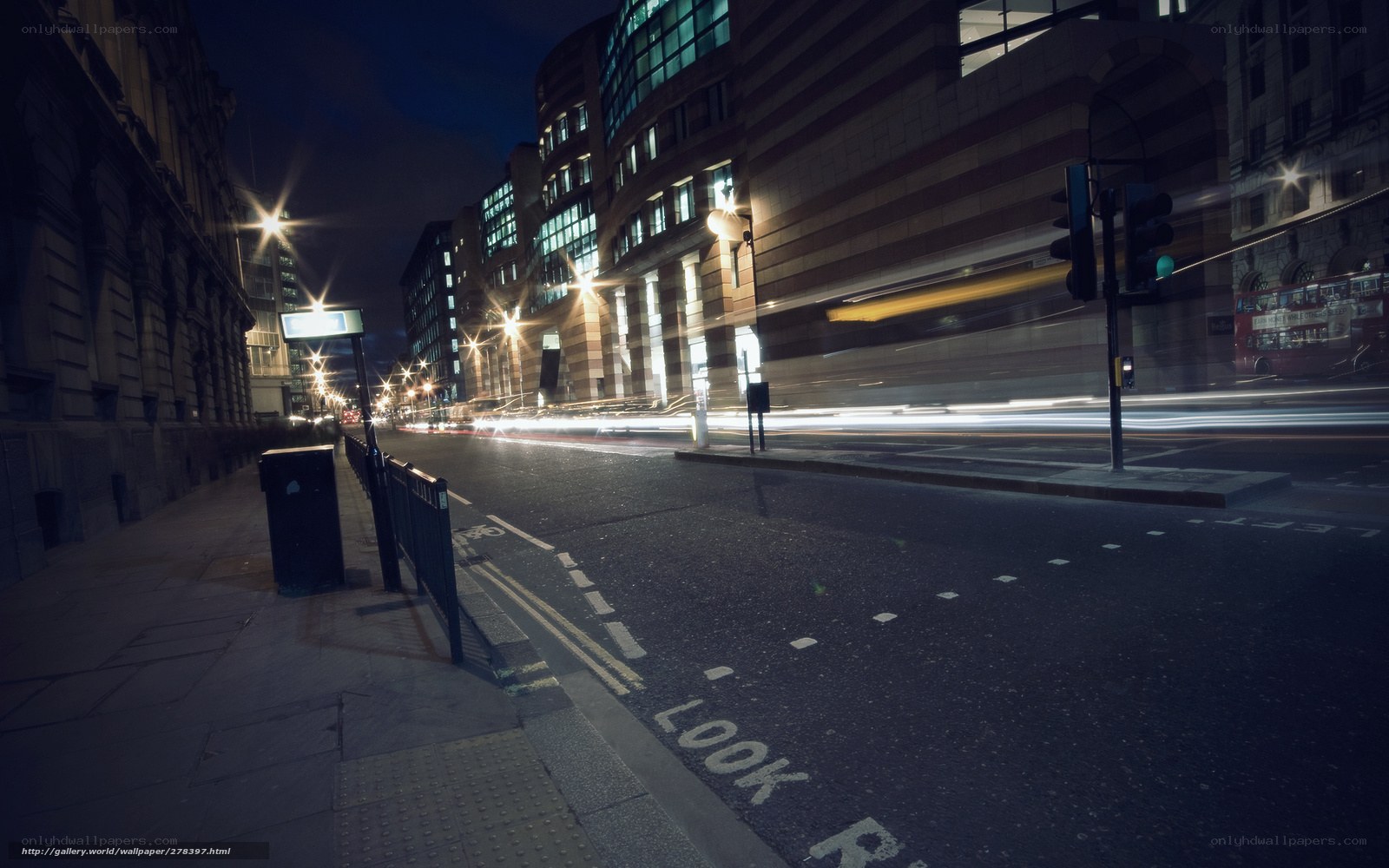 Nighttime city street with light trails
