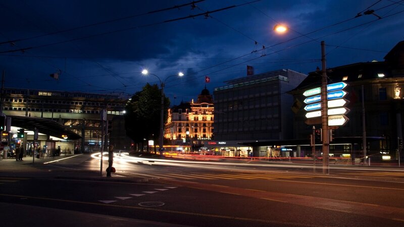 Nighttime city street with light trails