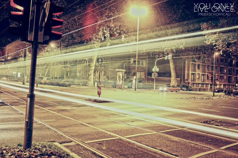 Nighttime city street with light trails