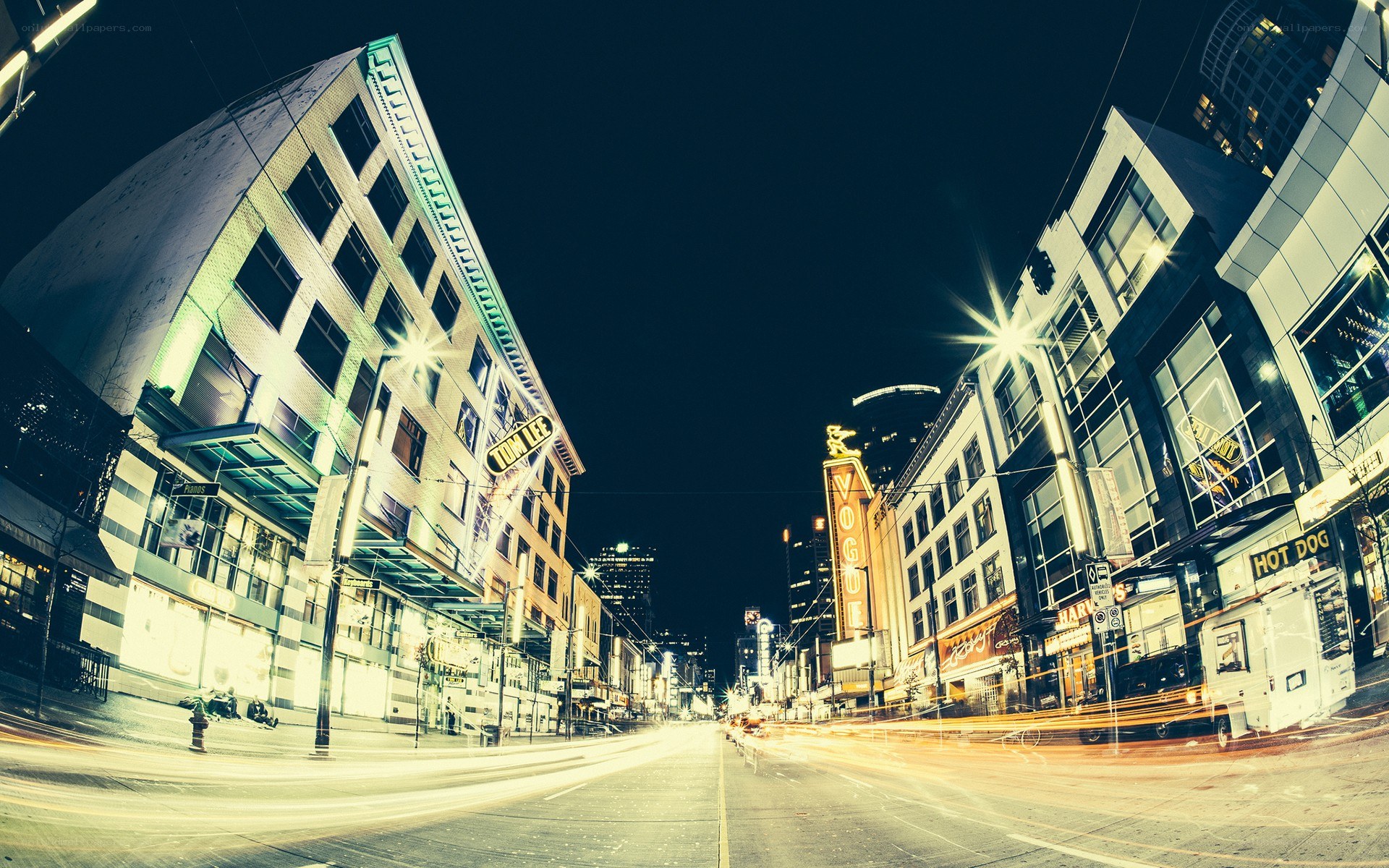 Nighttime city street with light trails