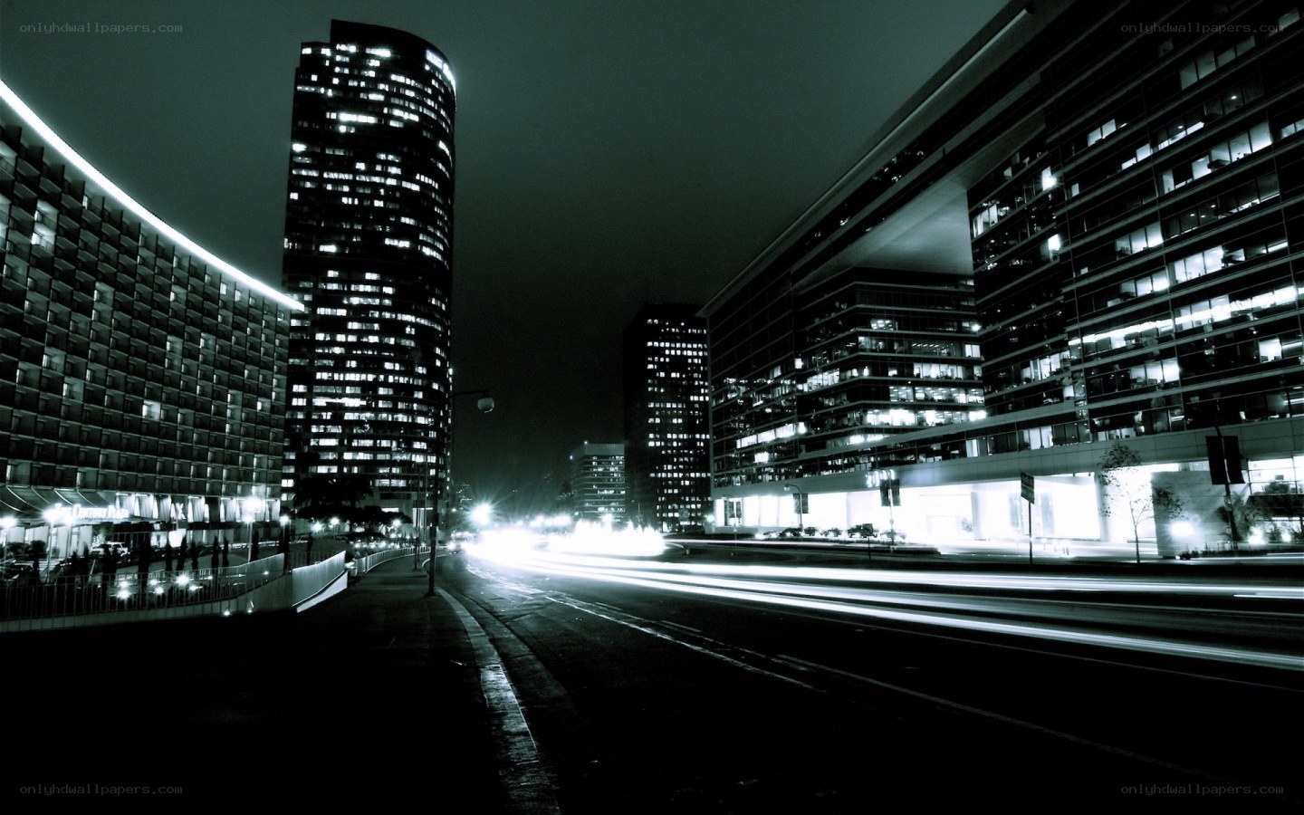 nighttime city street with light trails