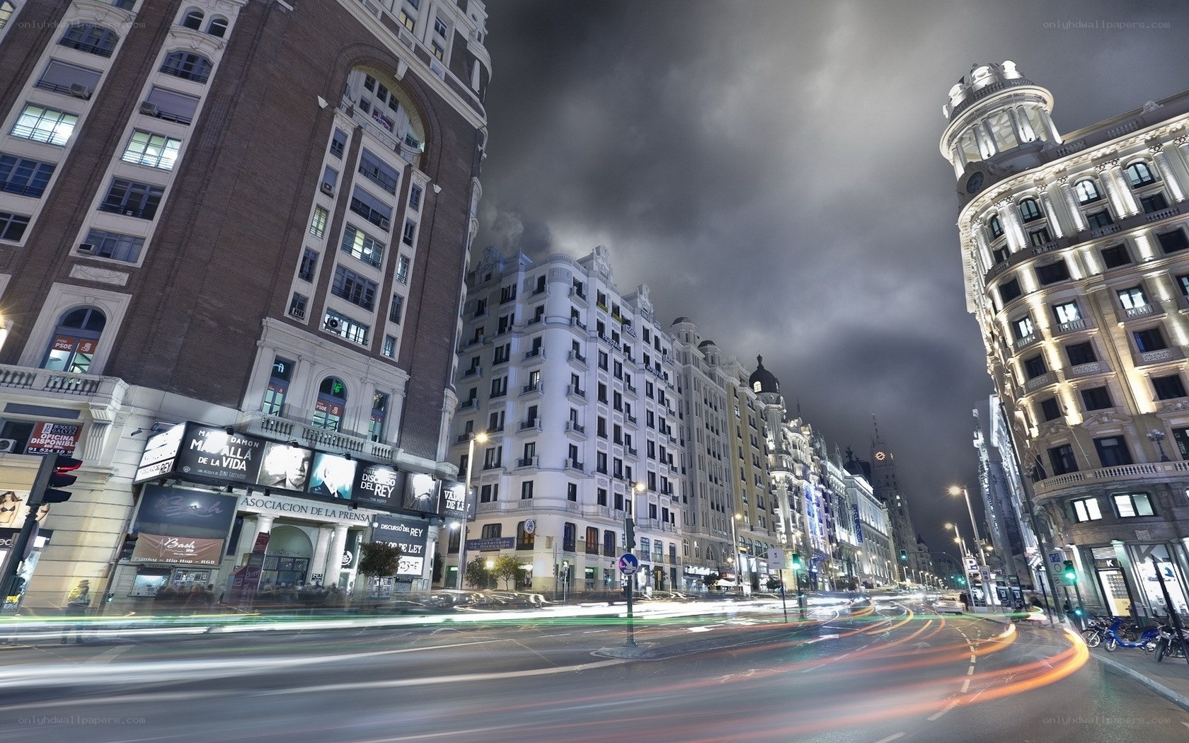Nighttime city street with light trails