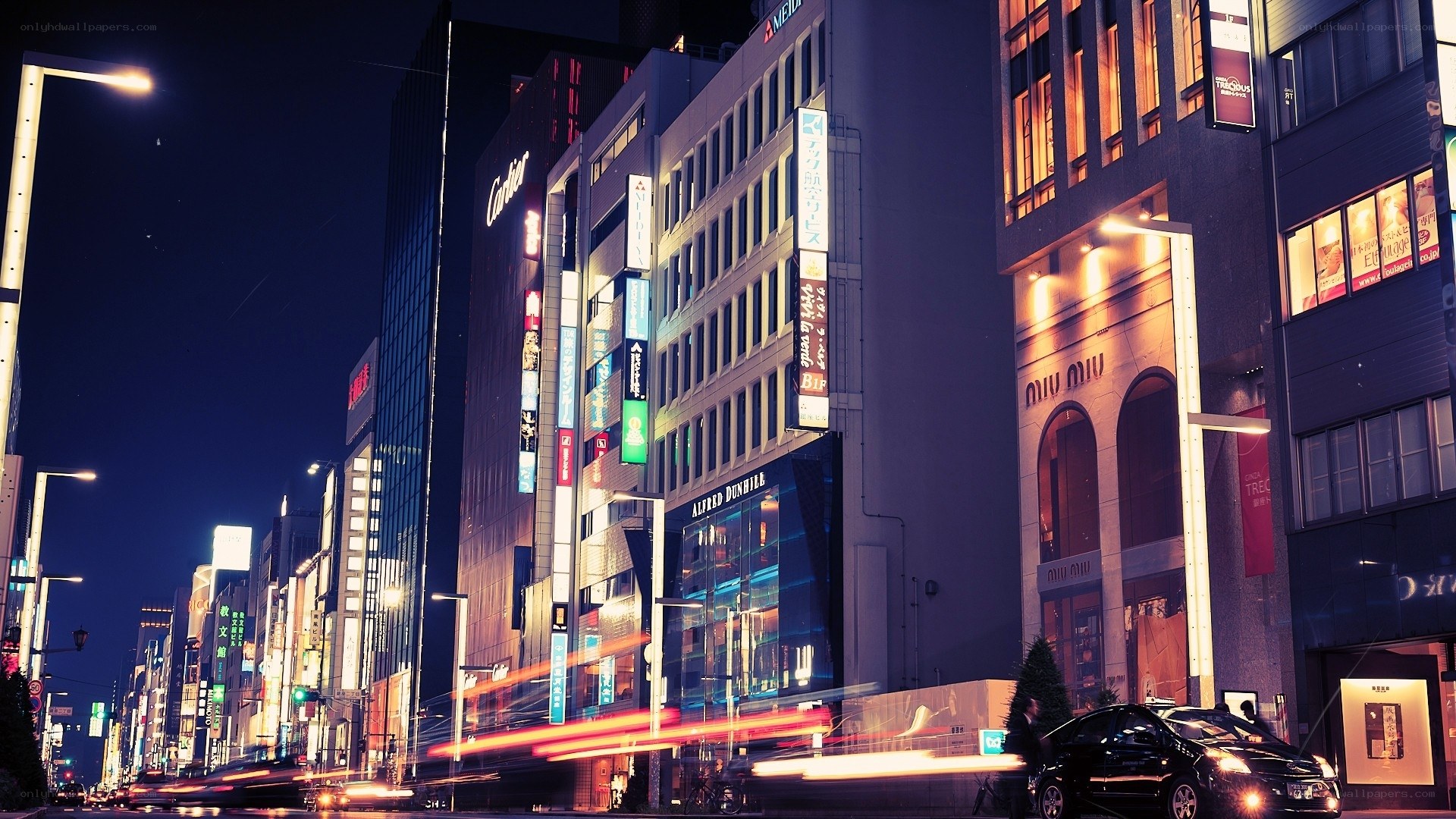 nighttime city street with lights