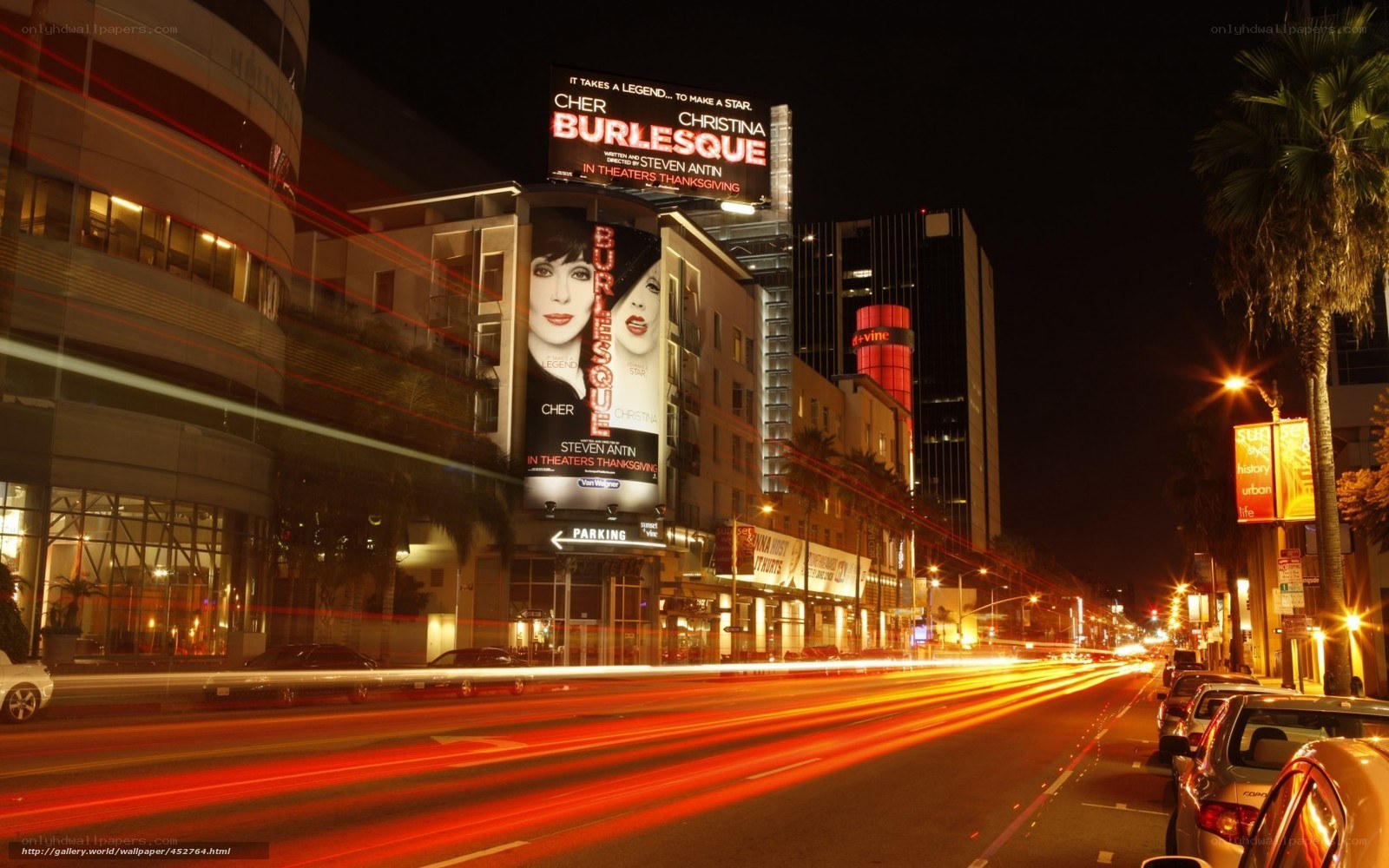 Nighttime city street with movie billboard