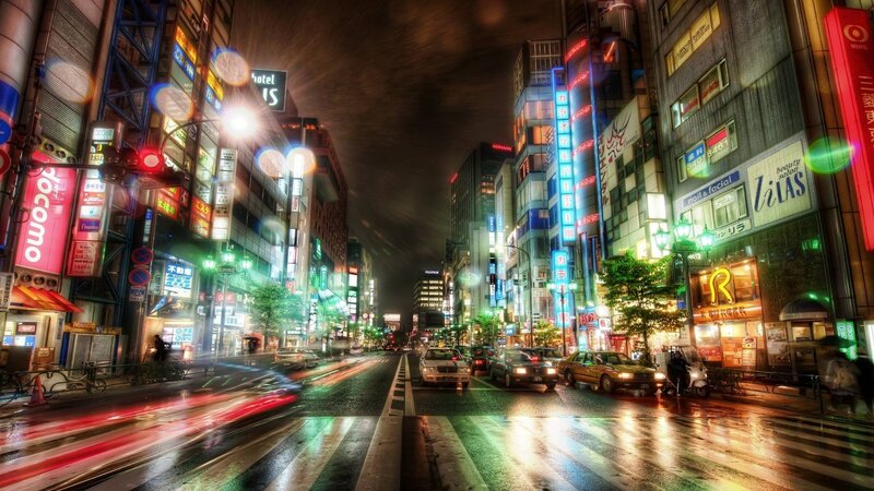 nighttime city street with neon lights