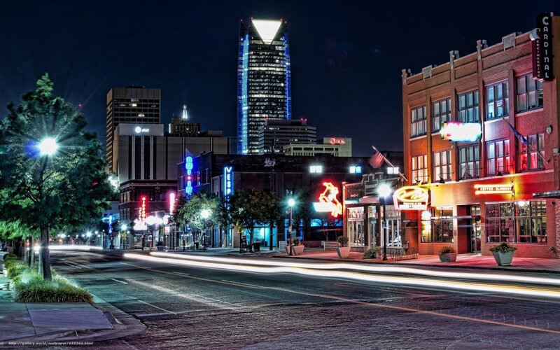 Nighttime city street with neon lights