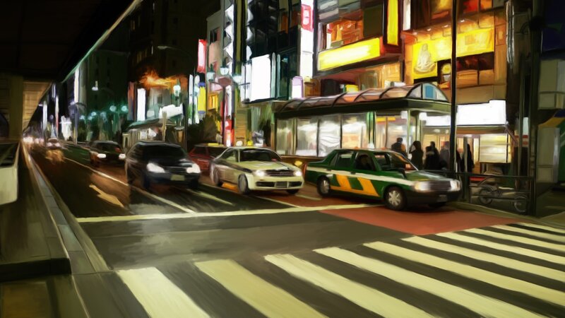 nighttime city street with taxis