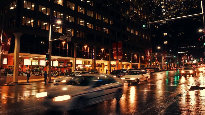 nighttime city street with traffic
