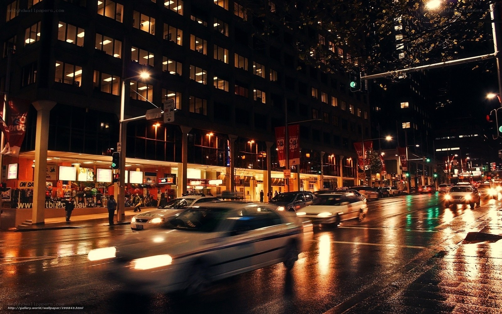 Nighttime city street with traffic