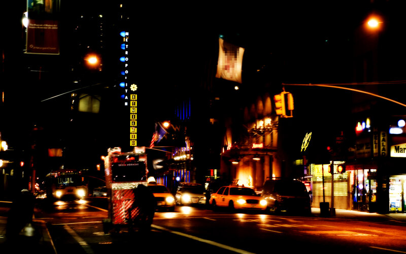 nighttime city street with traffic