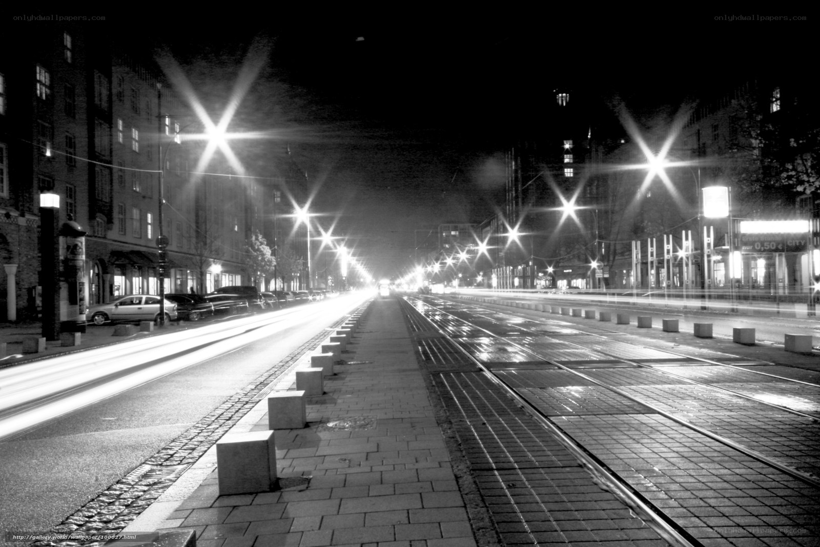 Nighttime city street with tram tracks