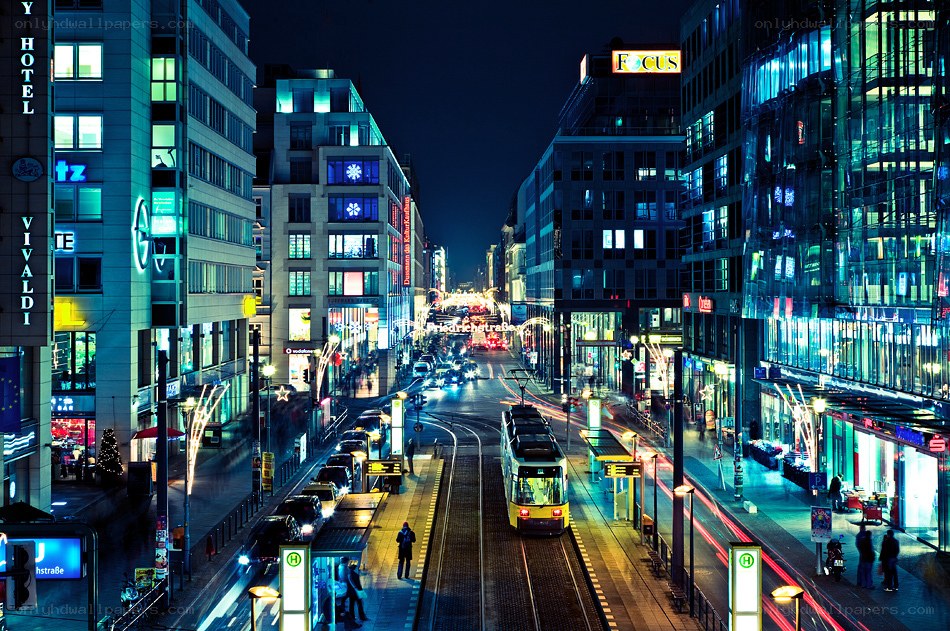Nighttime city street with tram