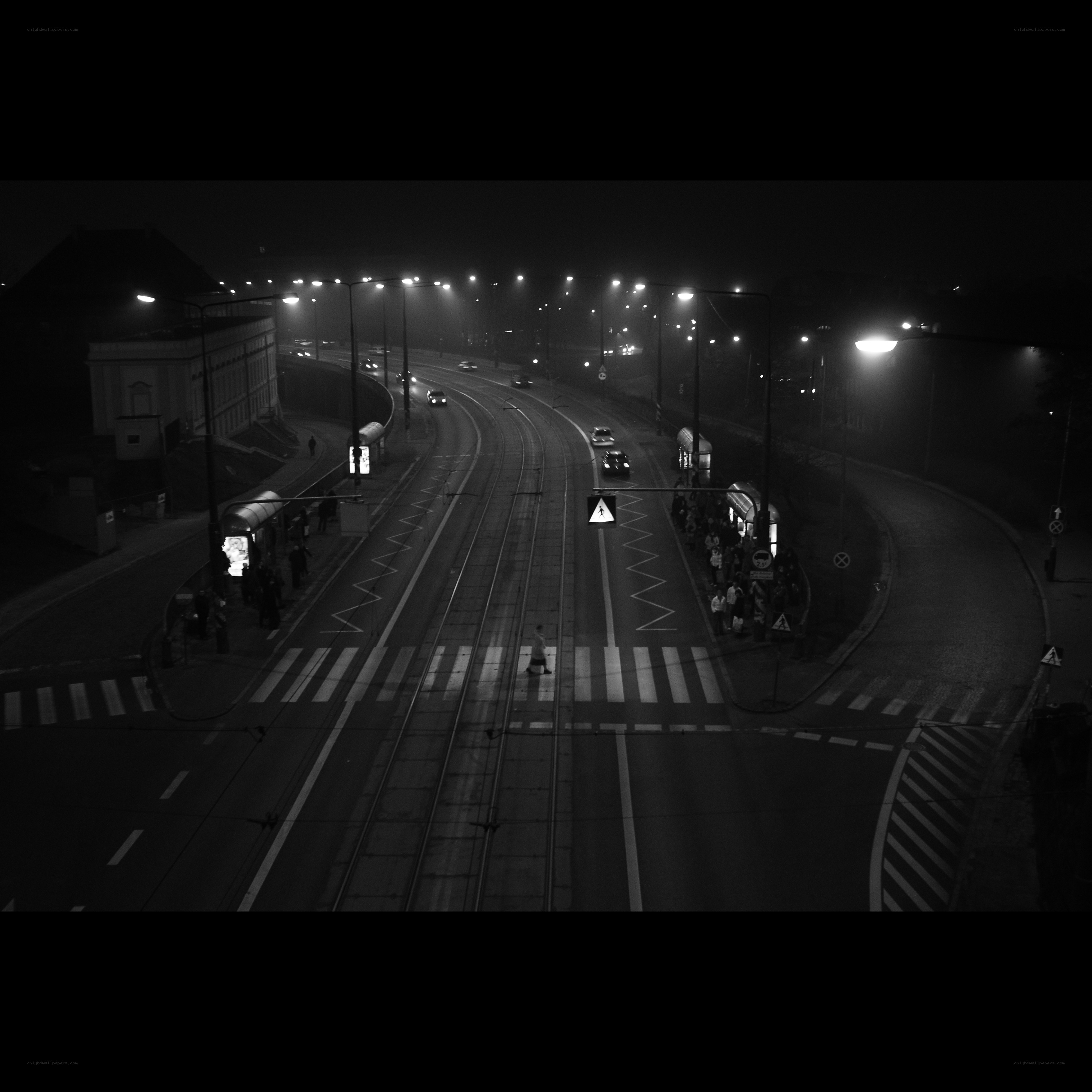 Nighttime city street with trams