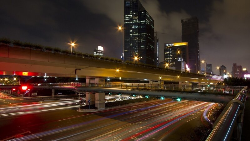 Nighttime city traffic and skyline