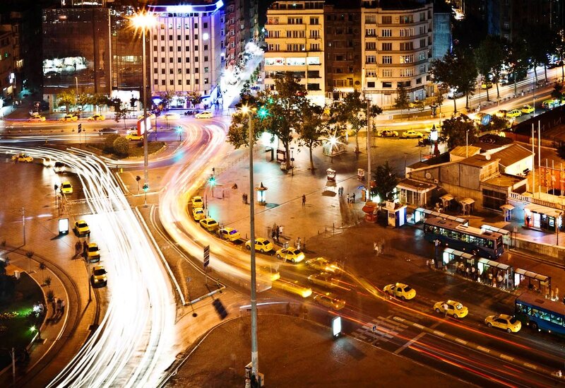 Nighttime city traffic at a roundabout
