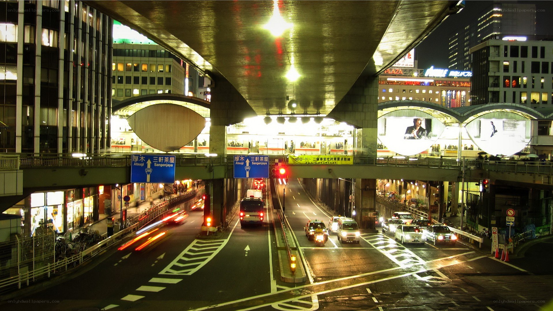 nighttime city traffic under overpass