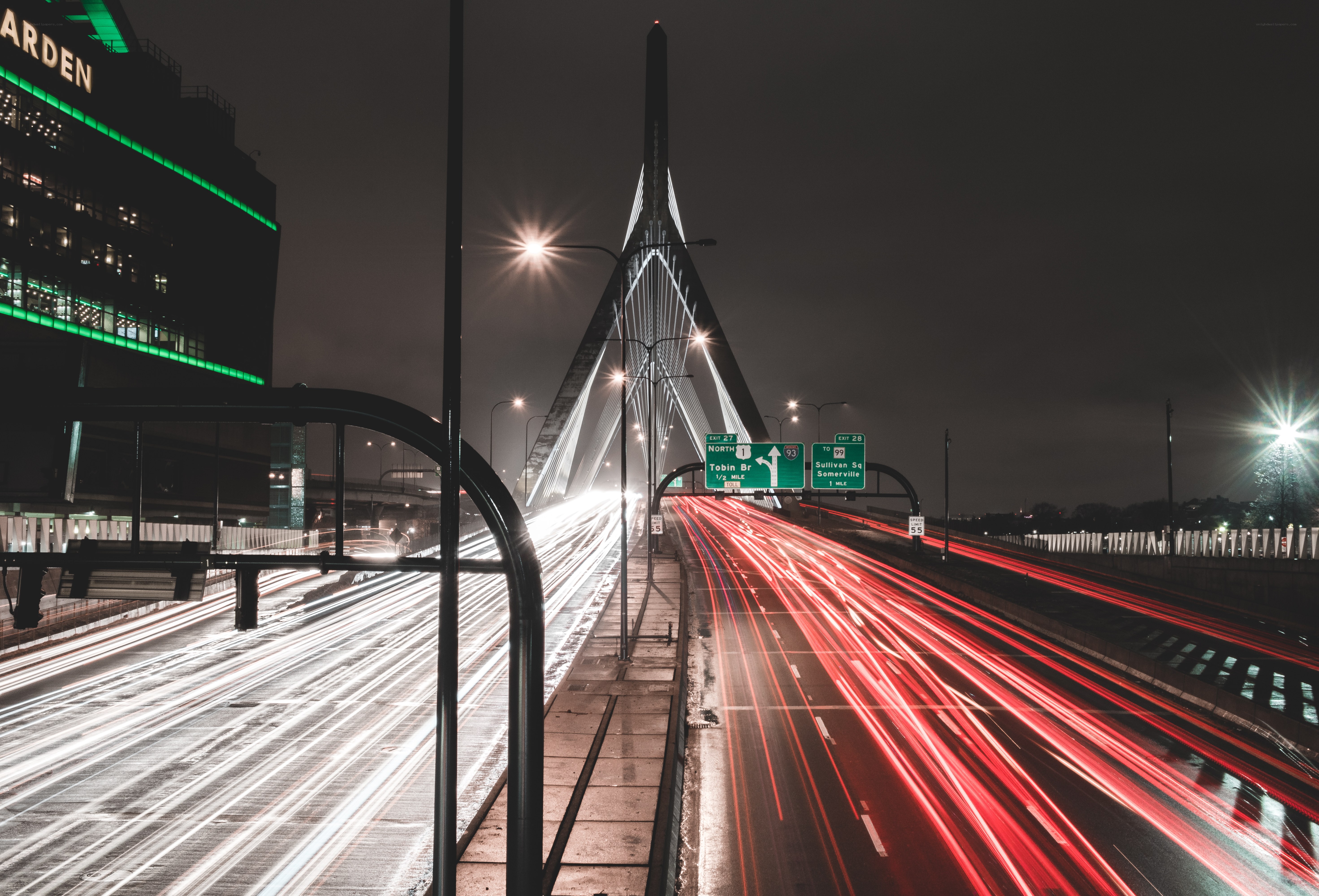 Nighttime city traffic with bridge