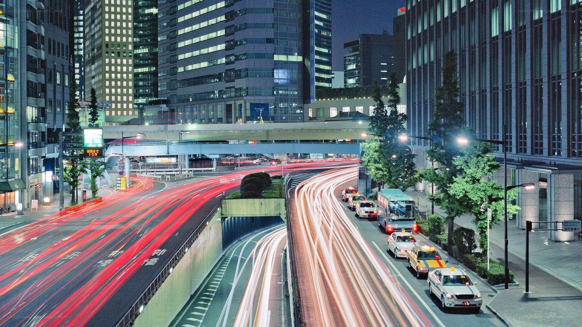 Nighttime city traffic with light trails