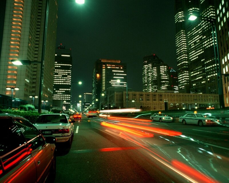 Nighttime city traffic with light trails