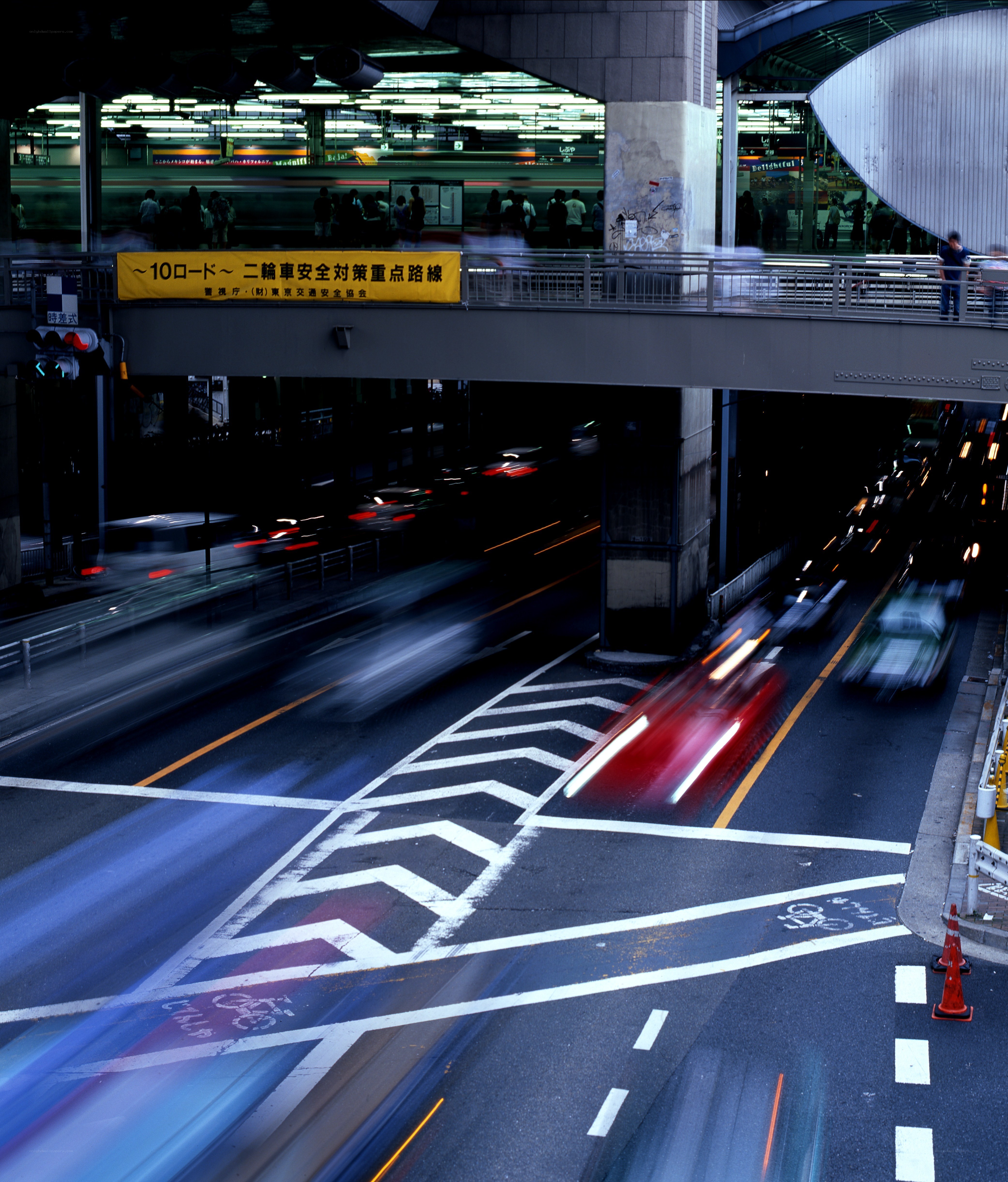 Nighttime city traffic with light trails