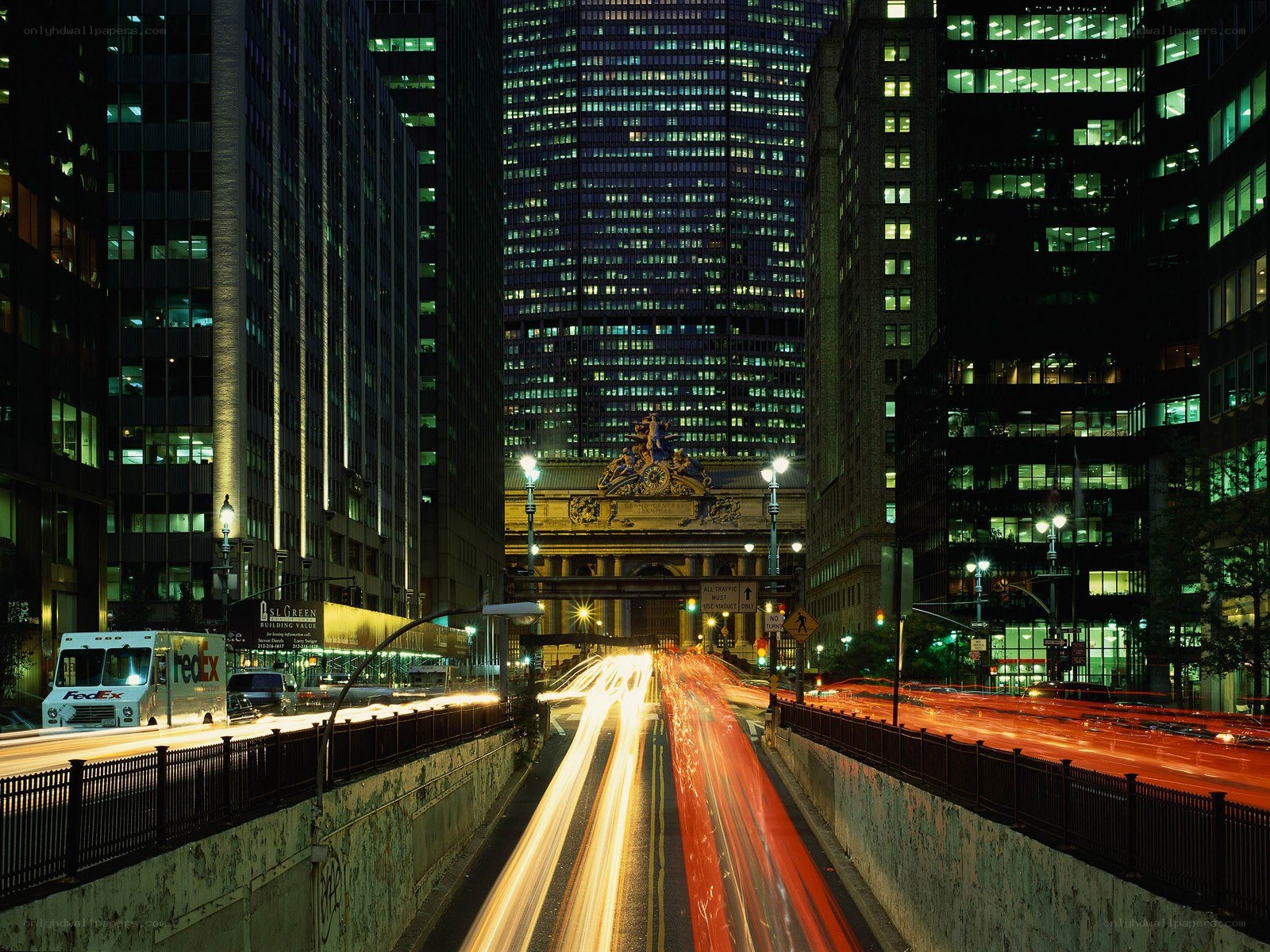 Nighttime city traffic with light trails