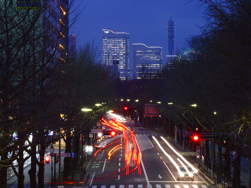 Nighttime city traffic with light trails