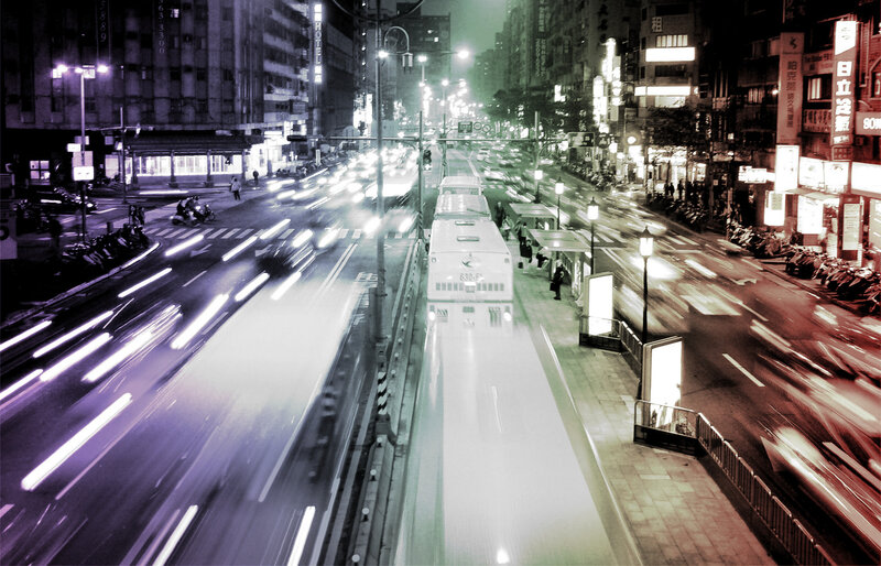 Nighttime city traffic with light trails