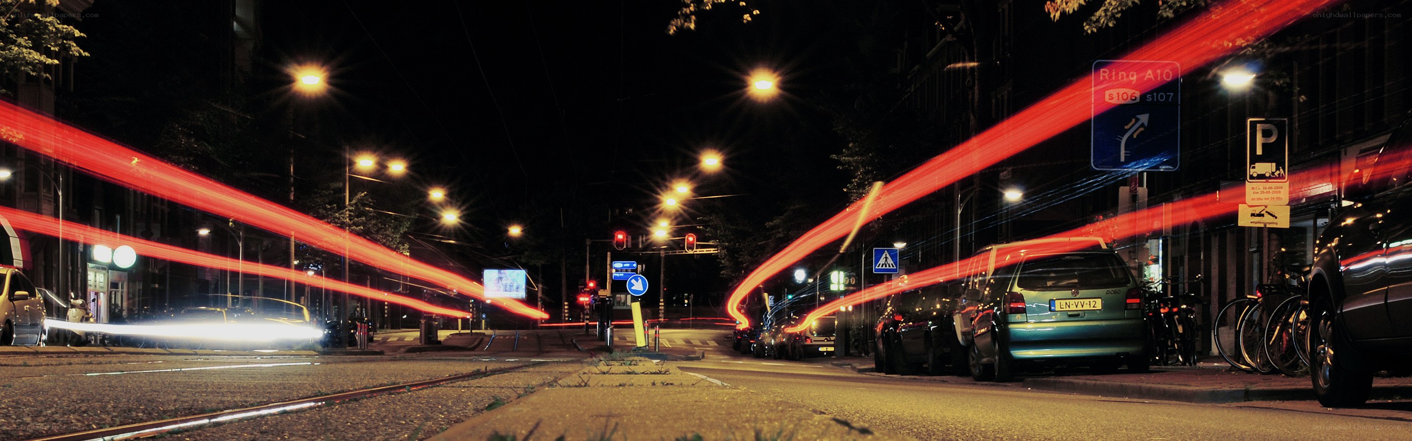Nighttime city traffic with light trails