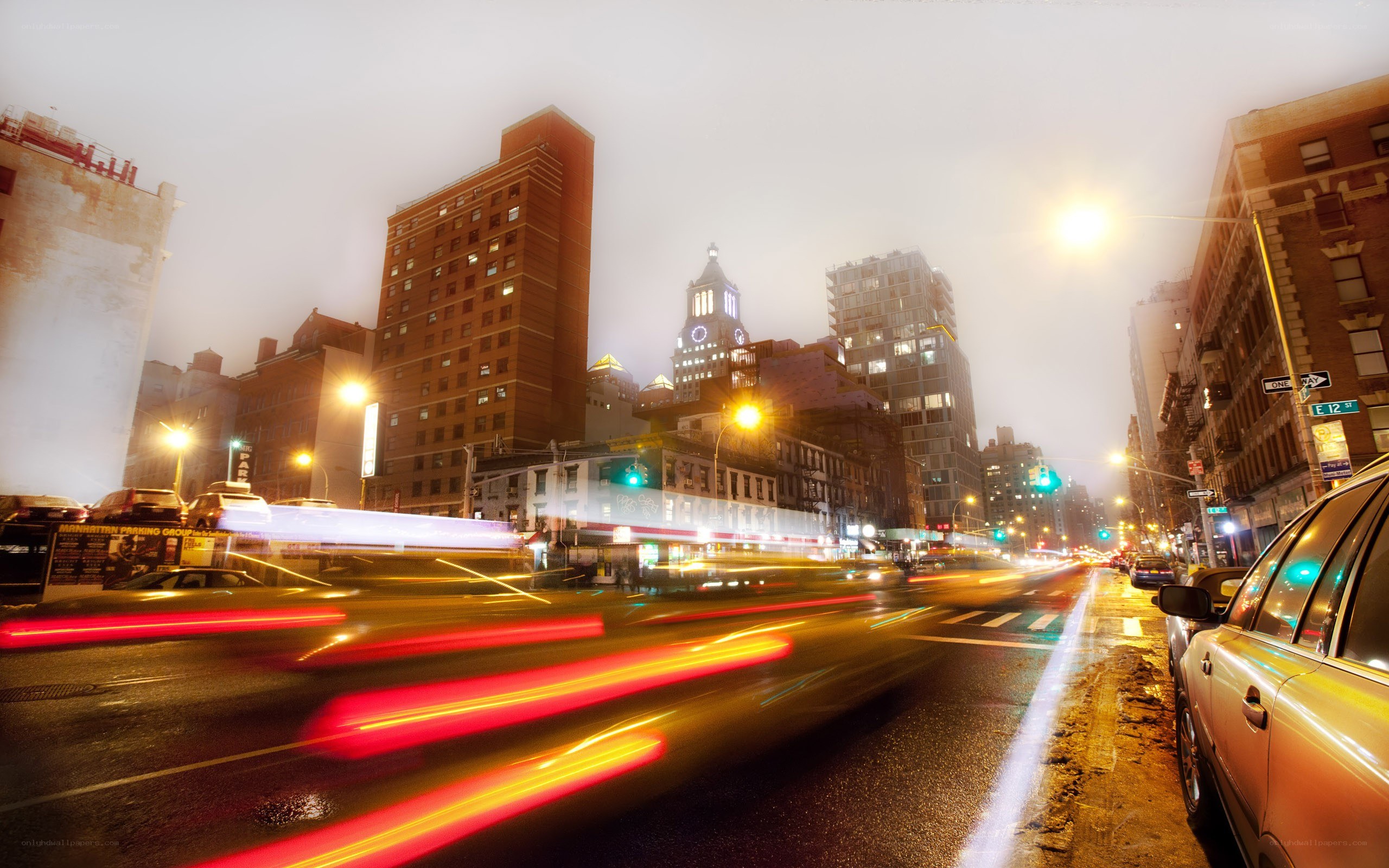 Nighttime city traffic with light trails