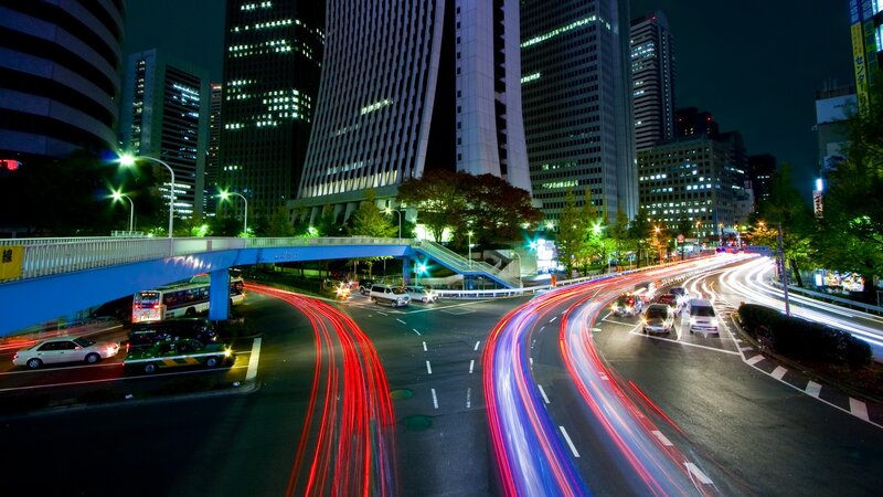 Nighttime city traffic with light trails