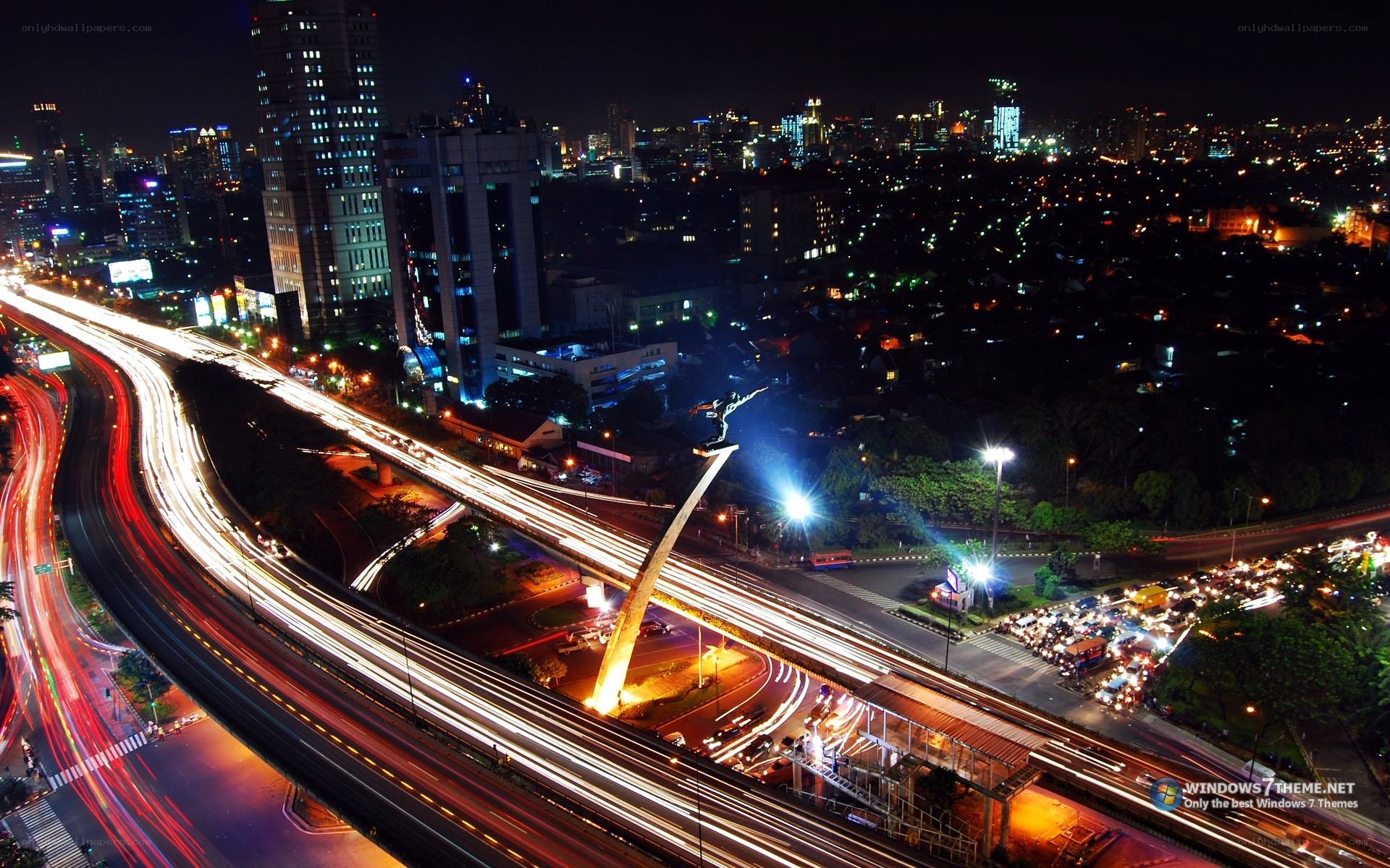 Nighttime city traffic with monument