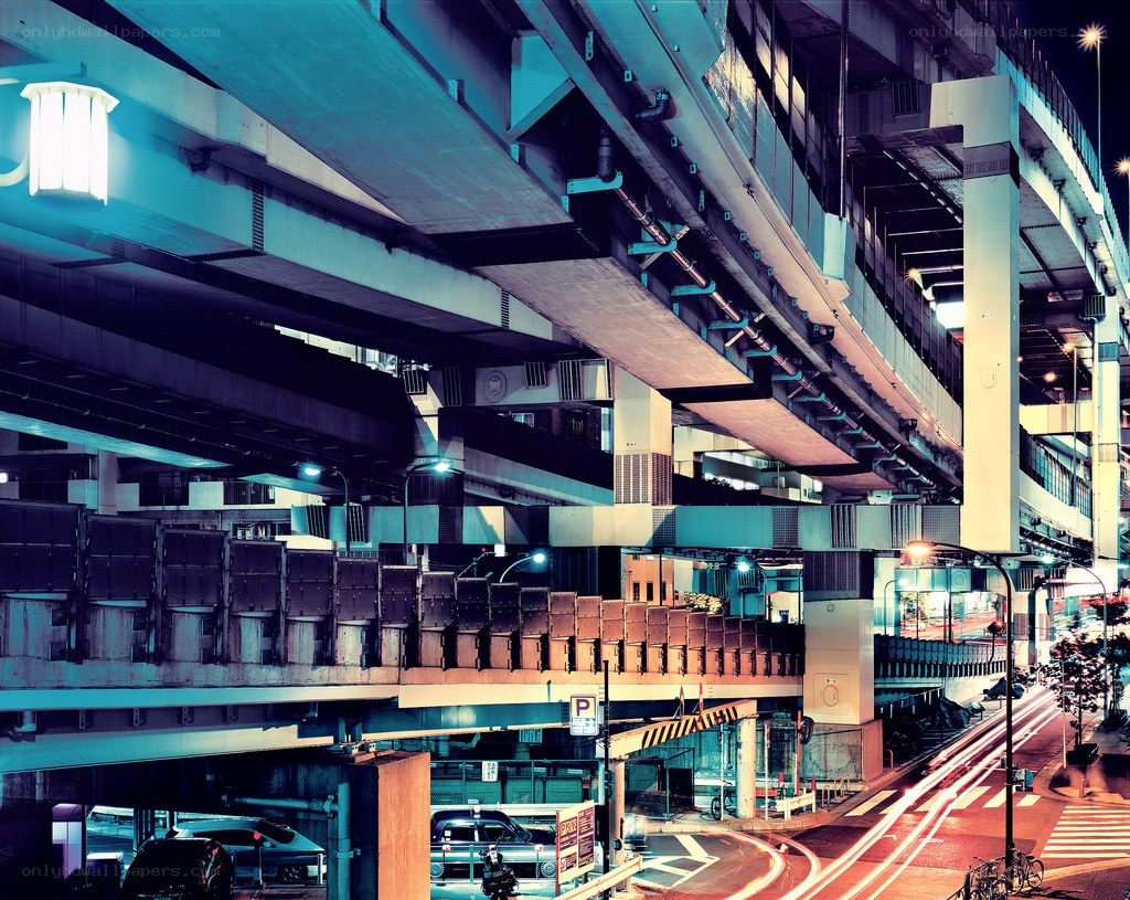 Nighttime city underpass with light trails