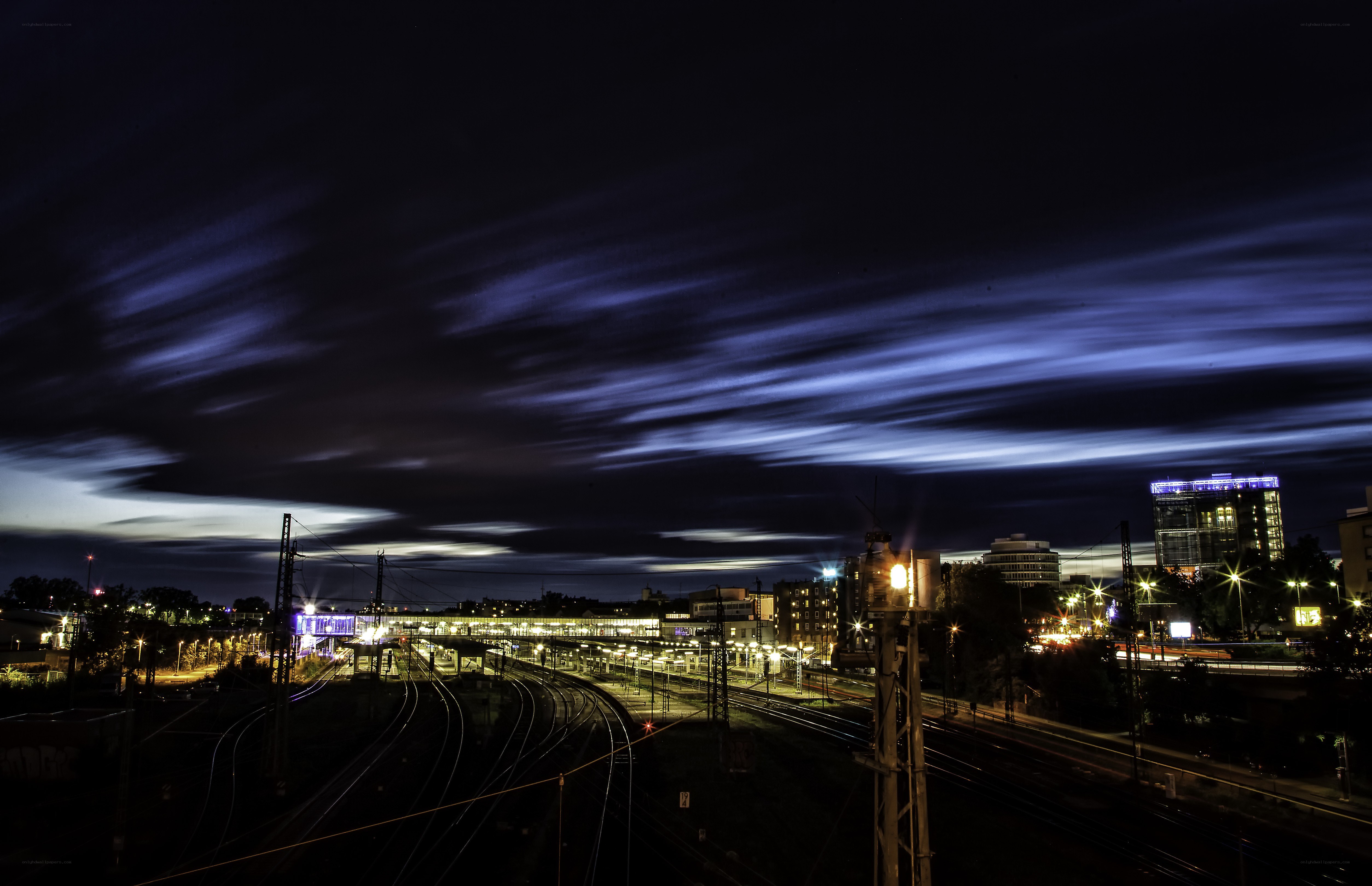 Nighttime city with train tracks