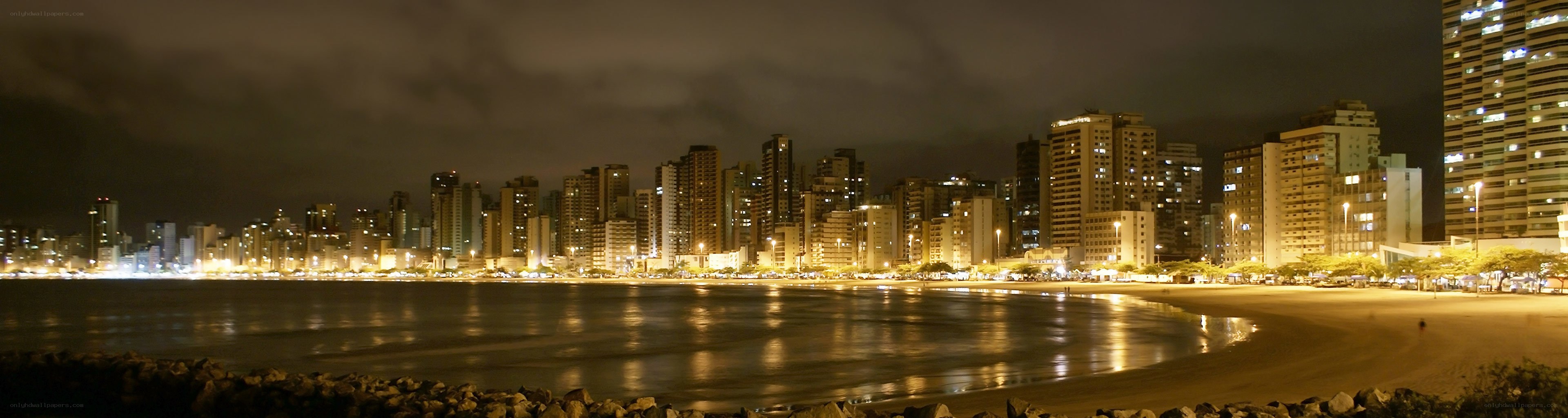 nighttime cityscape by the beach