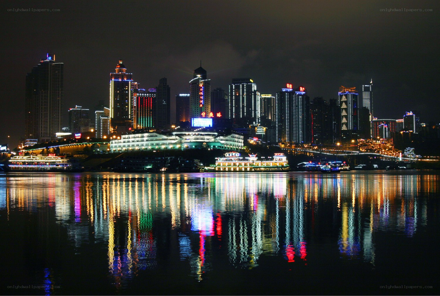 nighttime cityscape by the river