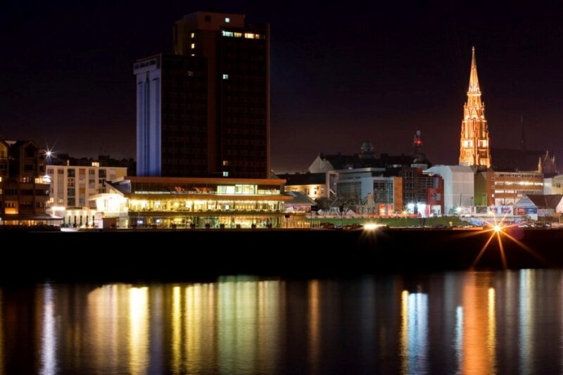 nighttime cityscape by the river