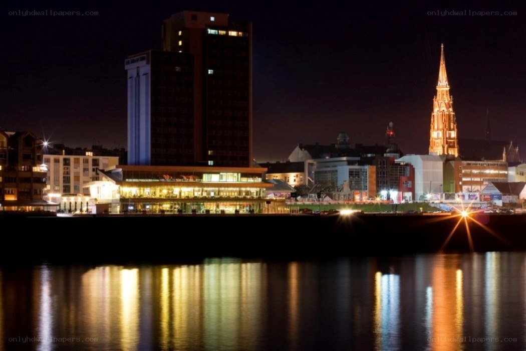 nighttime cityscape by the river