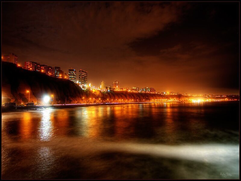 nighttime cityscape by the sea