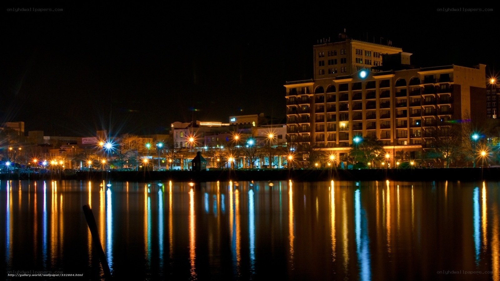 nighttime cityscape by the water