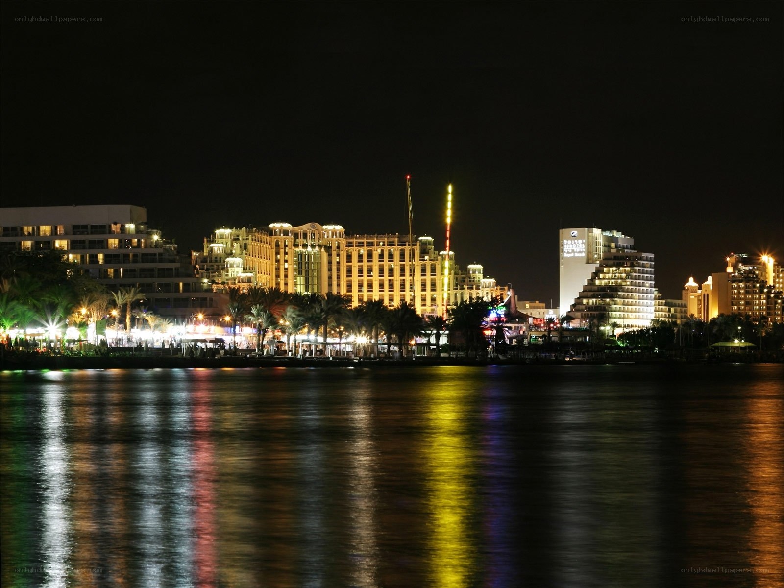 nighttime cityscape by the water