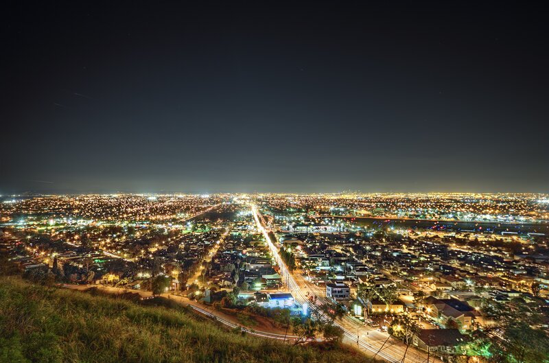 nighttime cityscape from hilltop