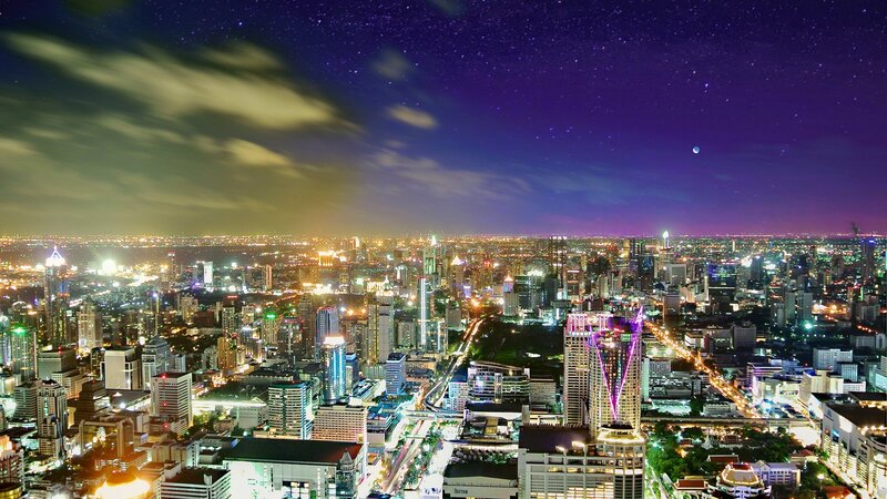 nighttime cityscape under starry sky