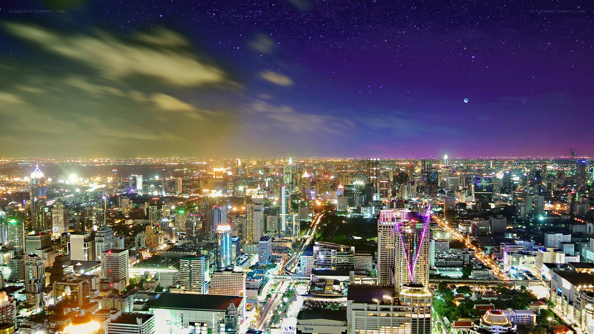 nighttime cityscape under starry sky