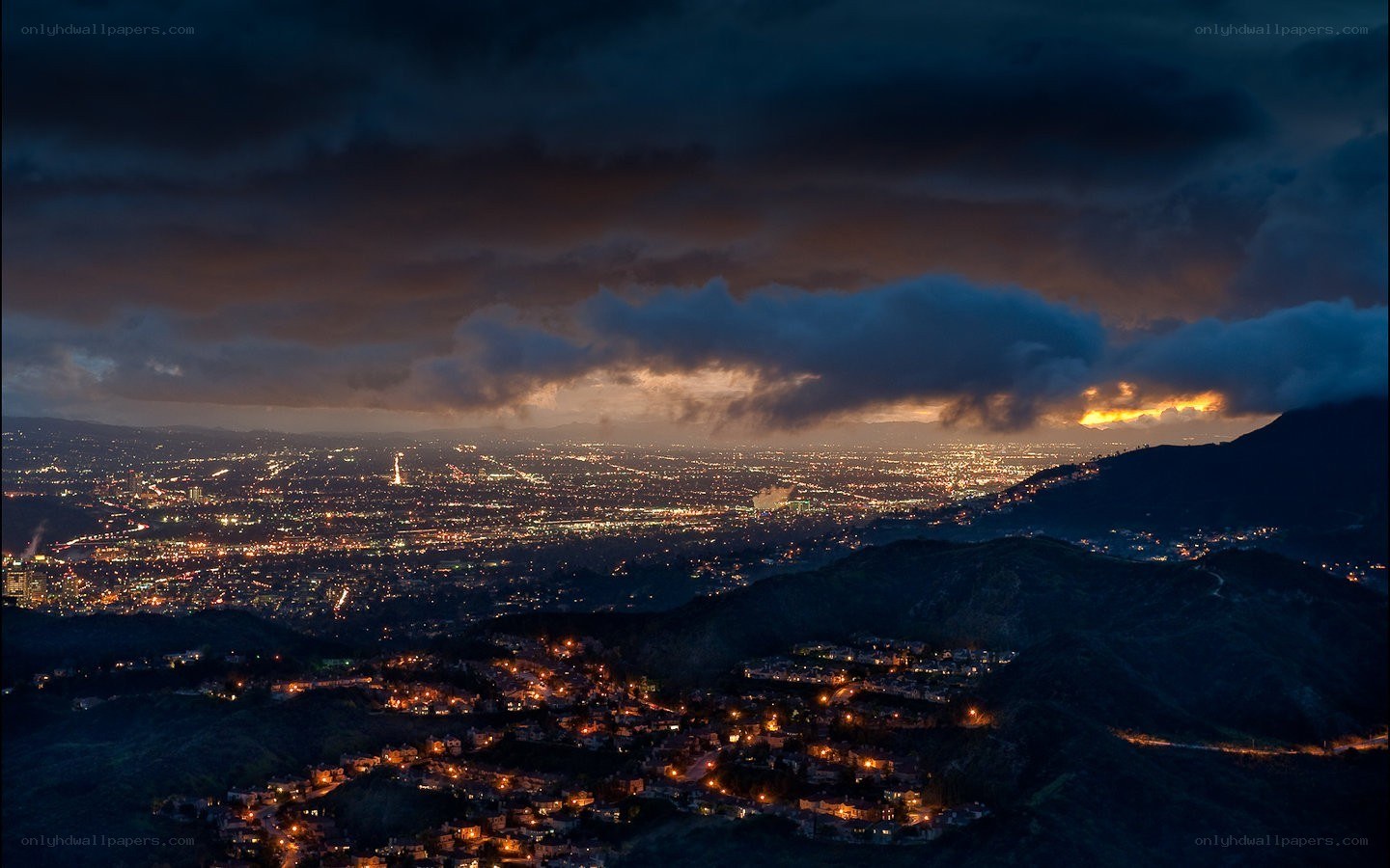 nighttime cityscape under stormy sky